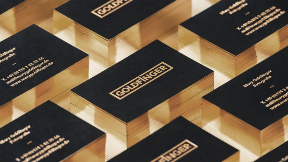 Thick premium business cards with reflective gold foil edges