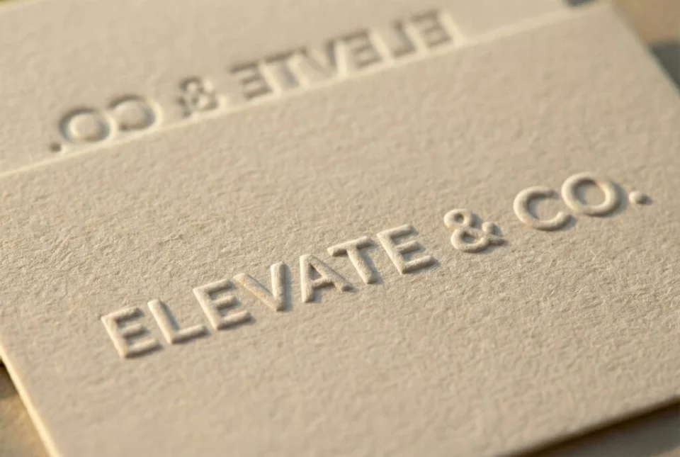 Minimal cream business card with raised blind embossing